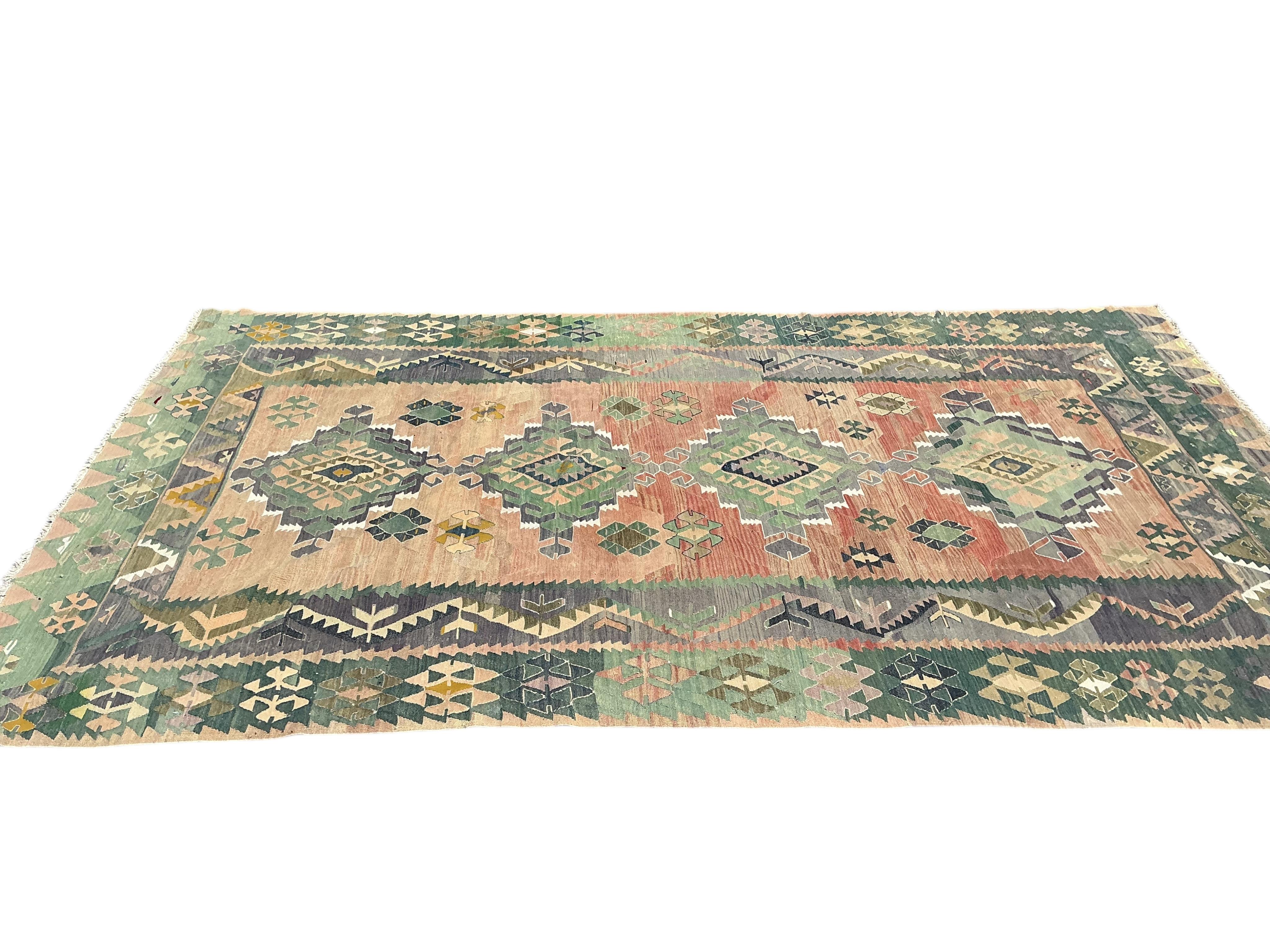 A Kelim polychrome medallion carpet, approximately 380 x 210cm